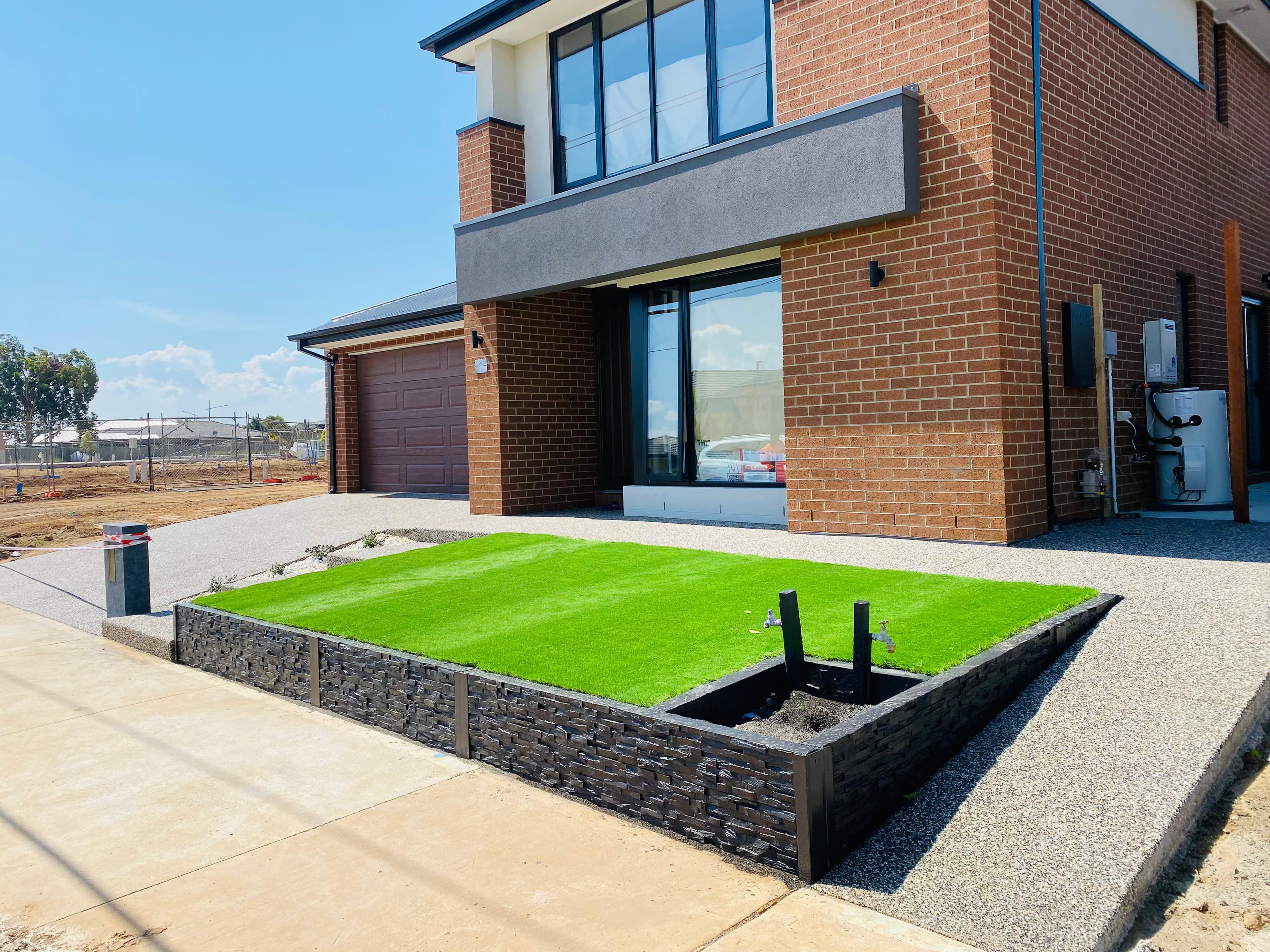 Exposed aggregate concrete driveway